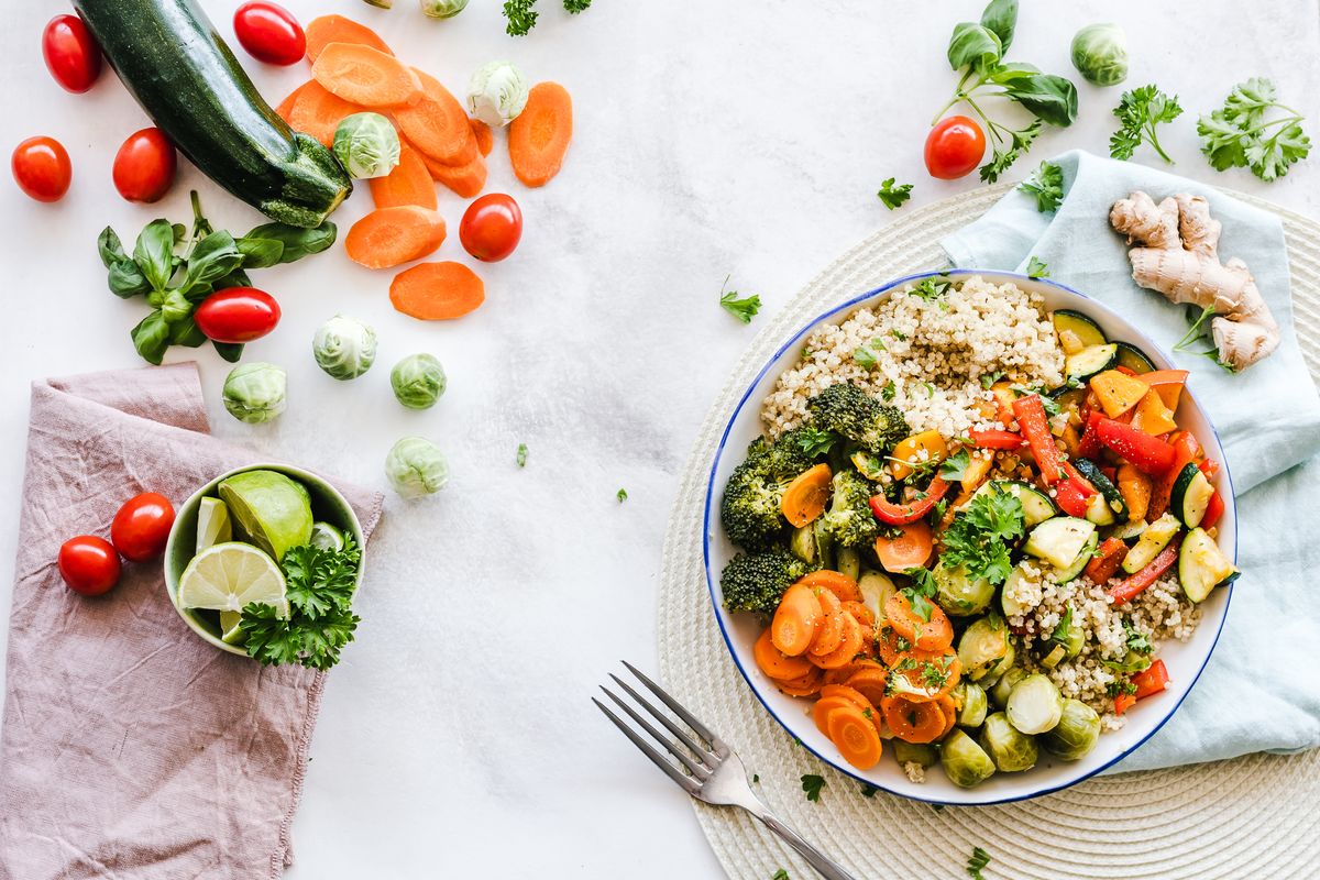 Illustrative food photograph: a flexible roasted-vegetable bowl for the food-waste conversation