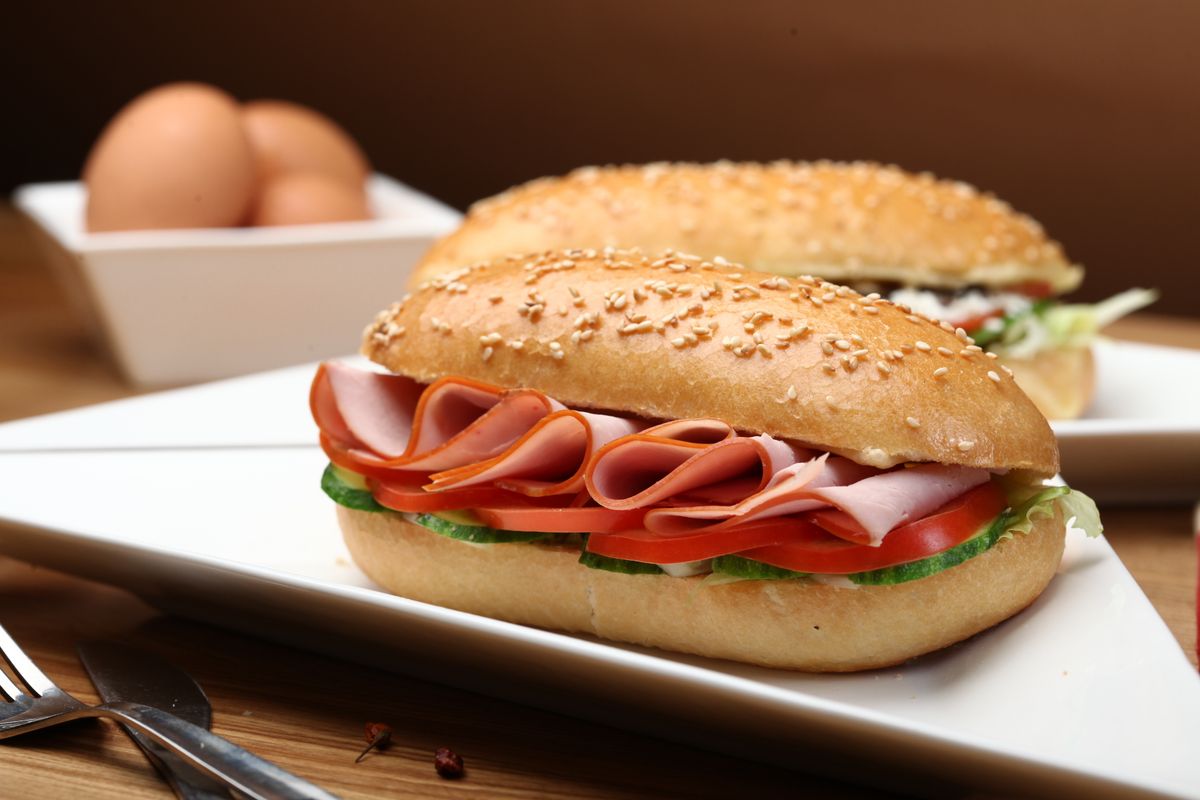 Illustrative food photograph: tomato and mozzarella breakfast rolls