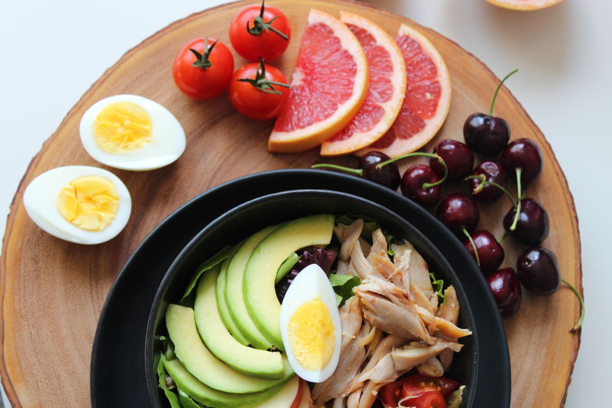 Illustrative food photograph: a colourful chicken-and-egg lunch bowl